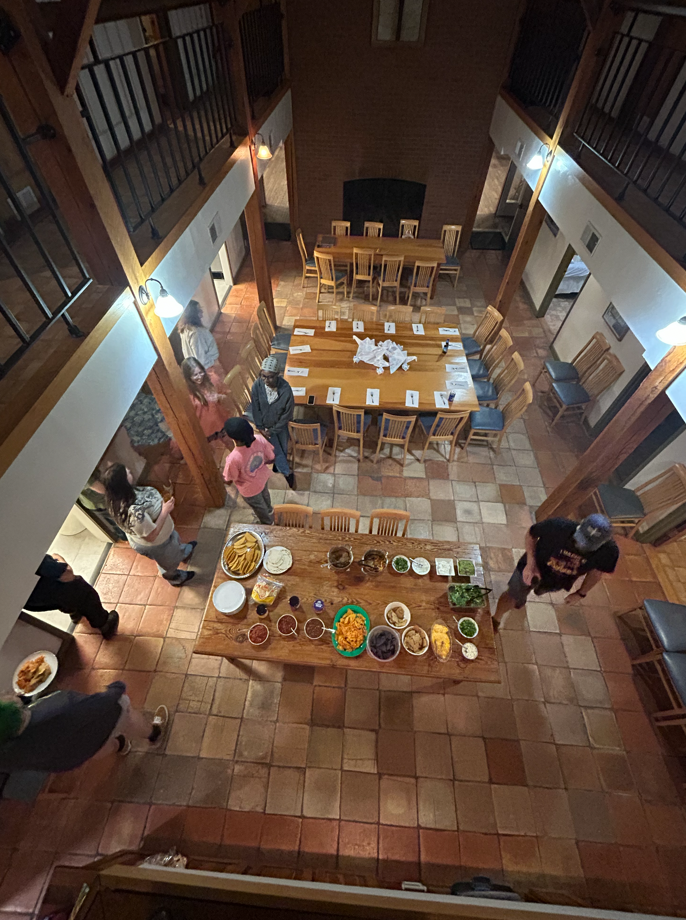 A photo from above looking down at a table full of plates of food.