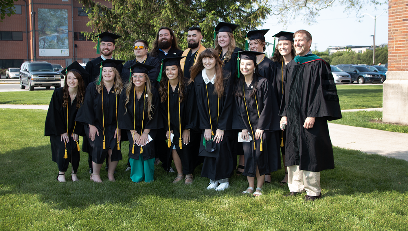 A group of graduates smiling