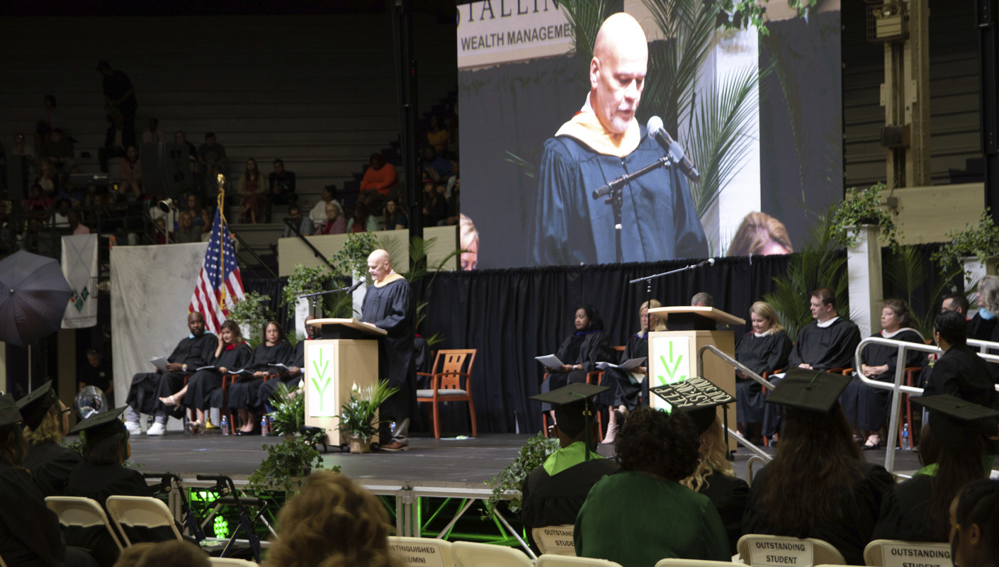 The stage at the commencement ceremony with Chancellor Scott speaking