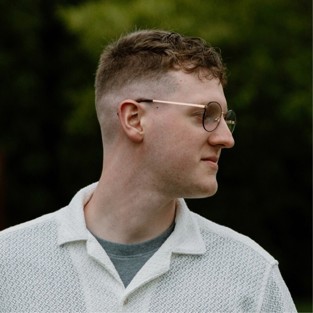 White male wearing glasses