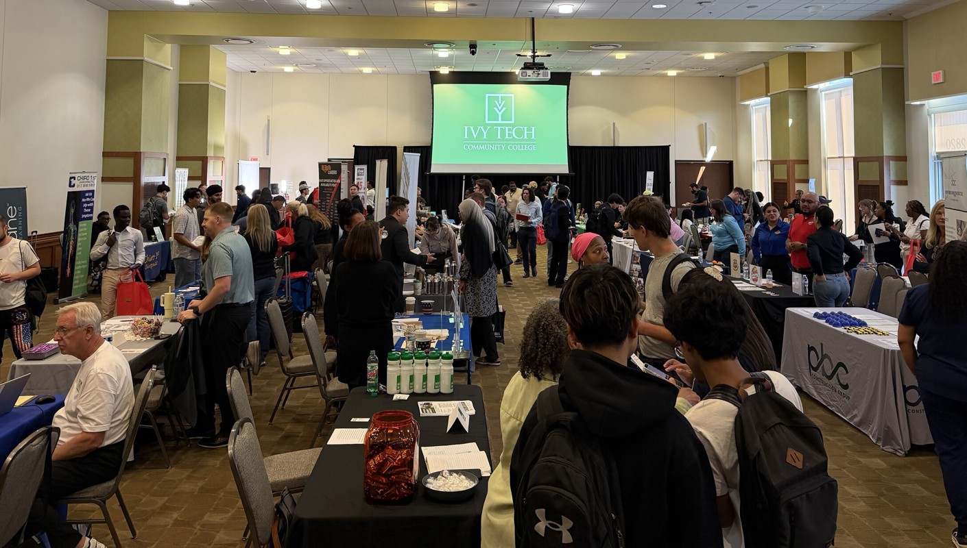 Dozens of people in the ballroom of the Conference Center and Culinary Institute at part time job fair at Ivy Tech Indianapolis
